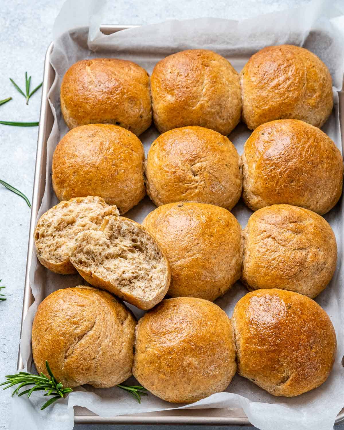 top view dinner rolls lined up on a pan