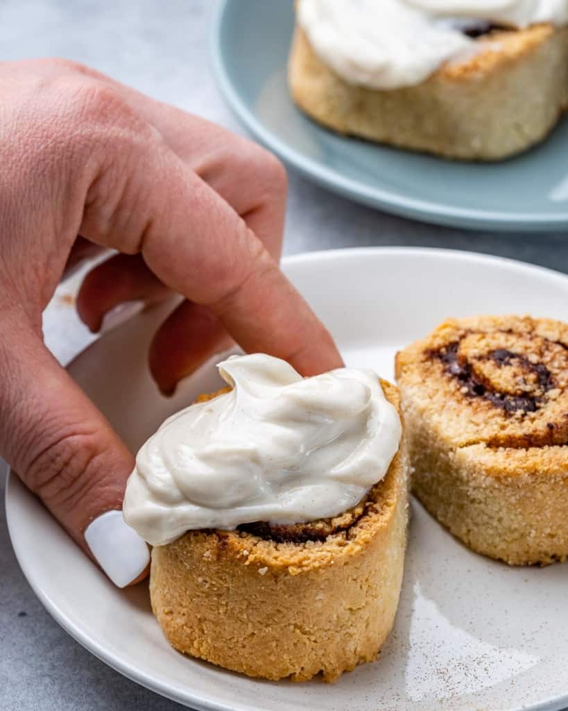 two cinnamon rolls on white plate