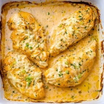 top view of baked buffali chicken breasts in a white dish