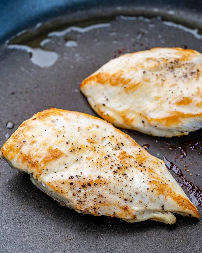 close up chicken breast on a skillet