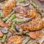 Chicken in pan with asparagus, celery, carrots, mushrooms, and other ingredients