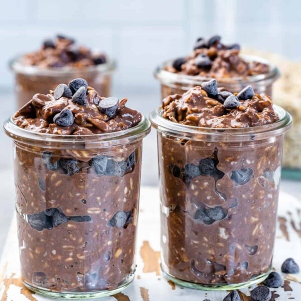 Four jars of oats with chocolate chips