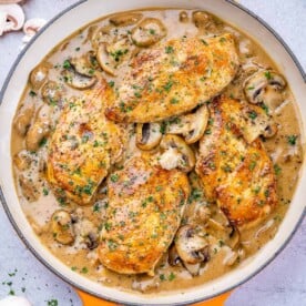 One pan filled with balsamic chicken skillet and mushrooms