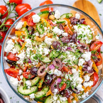 top view greek style chickpea salad in a clear bowl