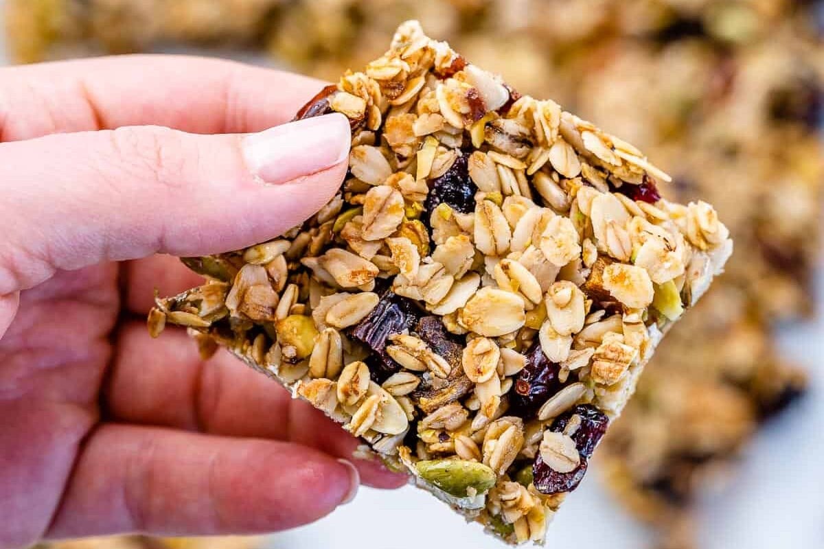 hand holding a granola bar