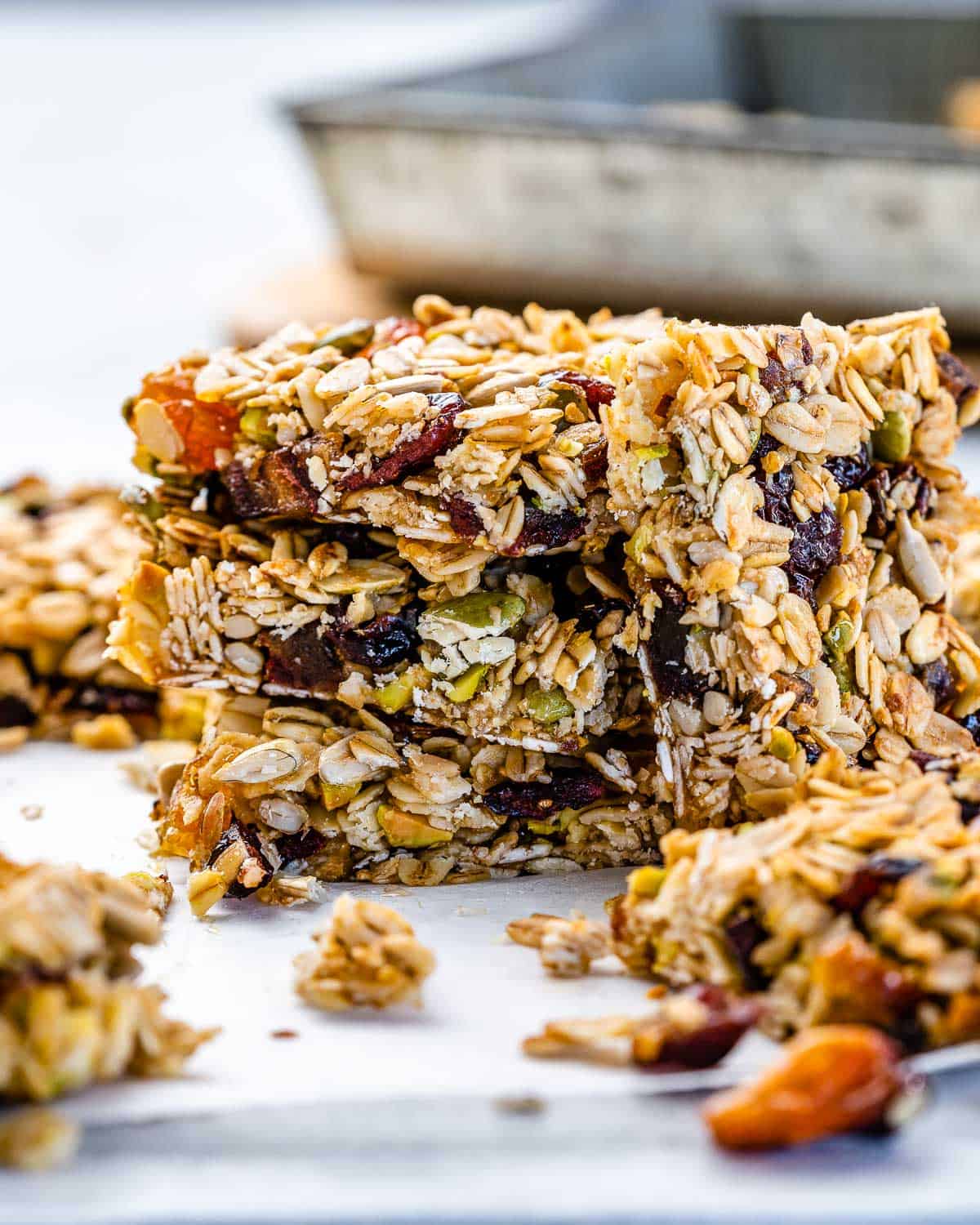 Oatmeal Granola Bars from Scratch 8 Side view of a perfectly stacked pile of homemade oatmeal granola bars, highlighting their golden-brown edges and inviting texture.