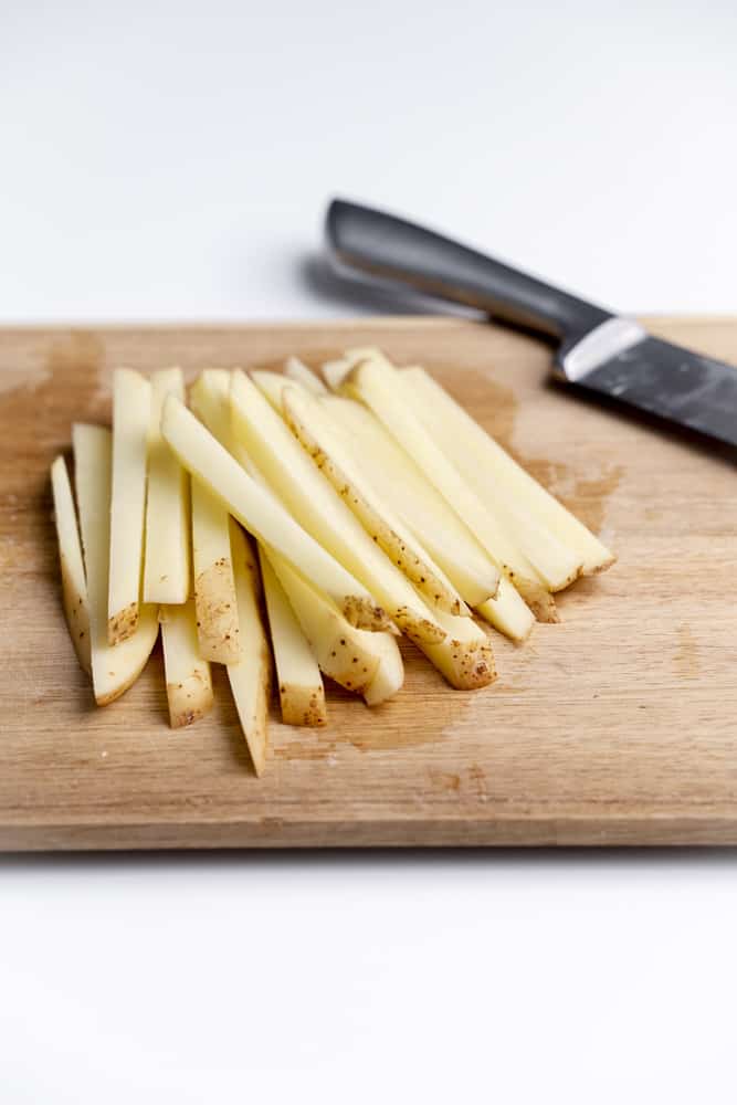 potato slices on cutting board
