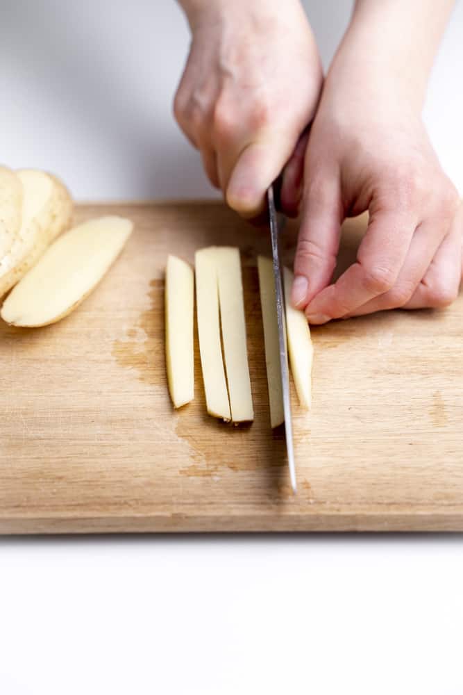 slicing potato with knife