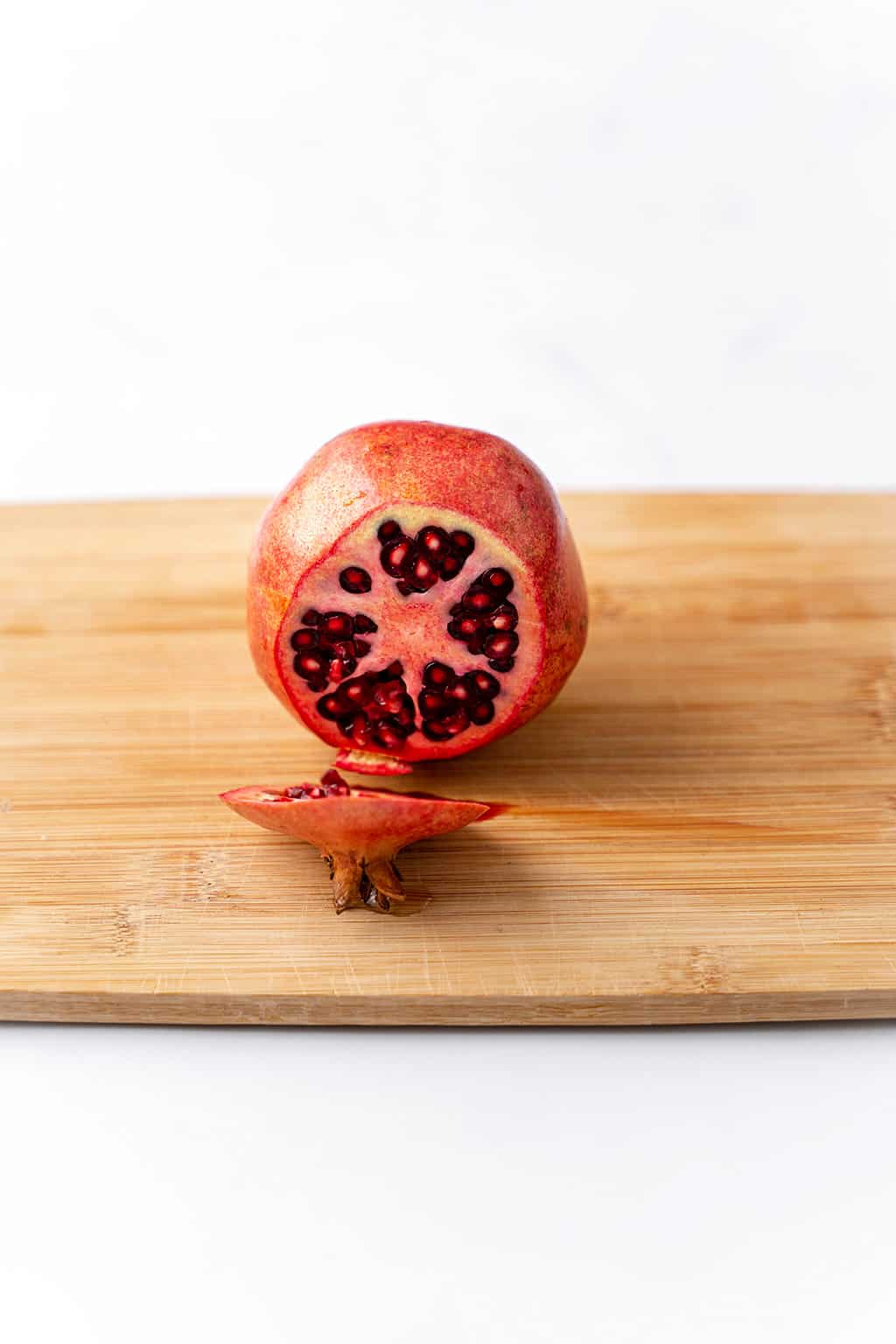 one end of the pomegranate sliced 