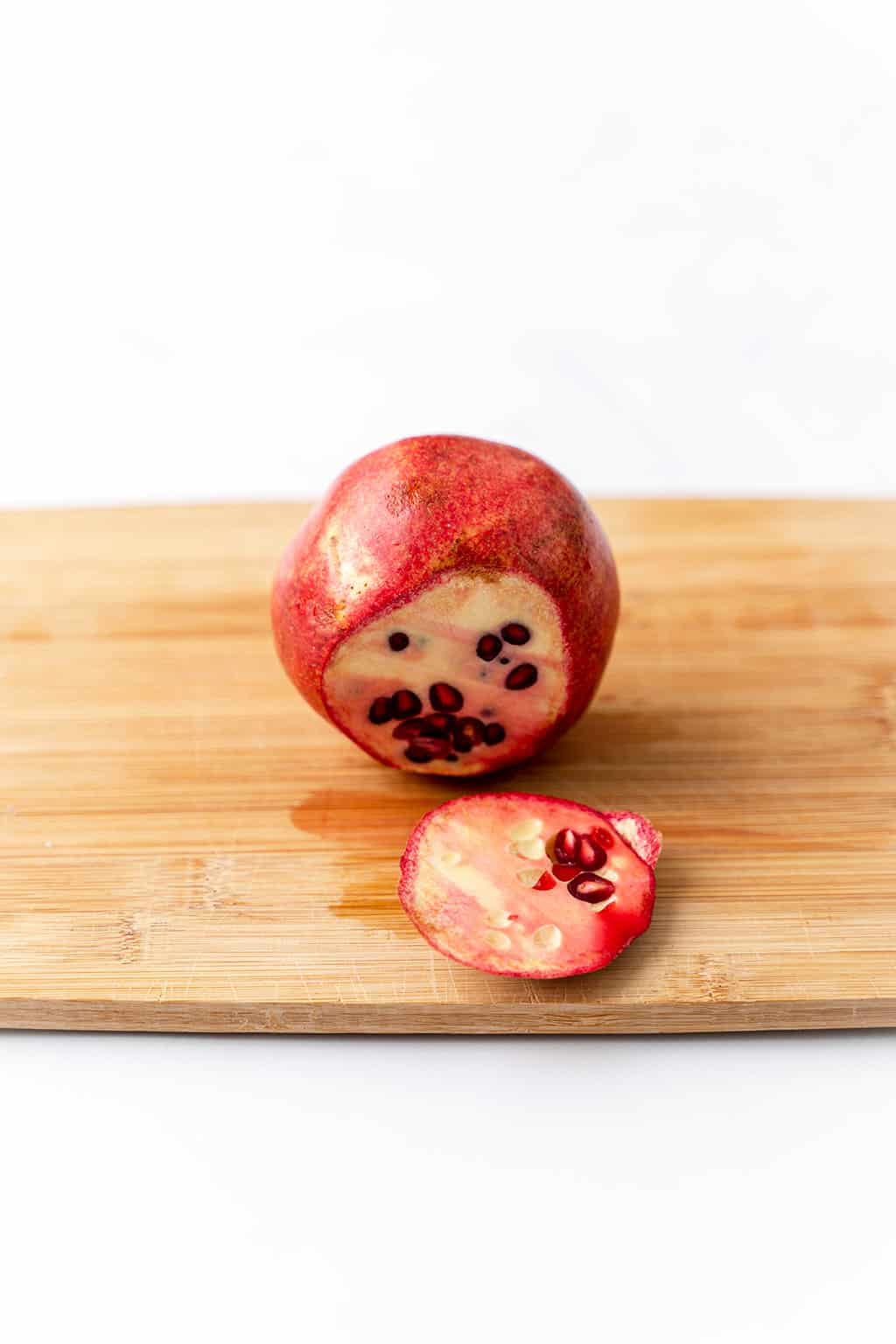 one pomegranate with skin showing 