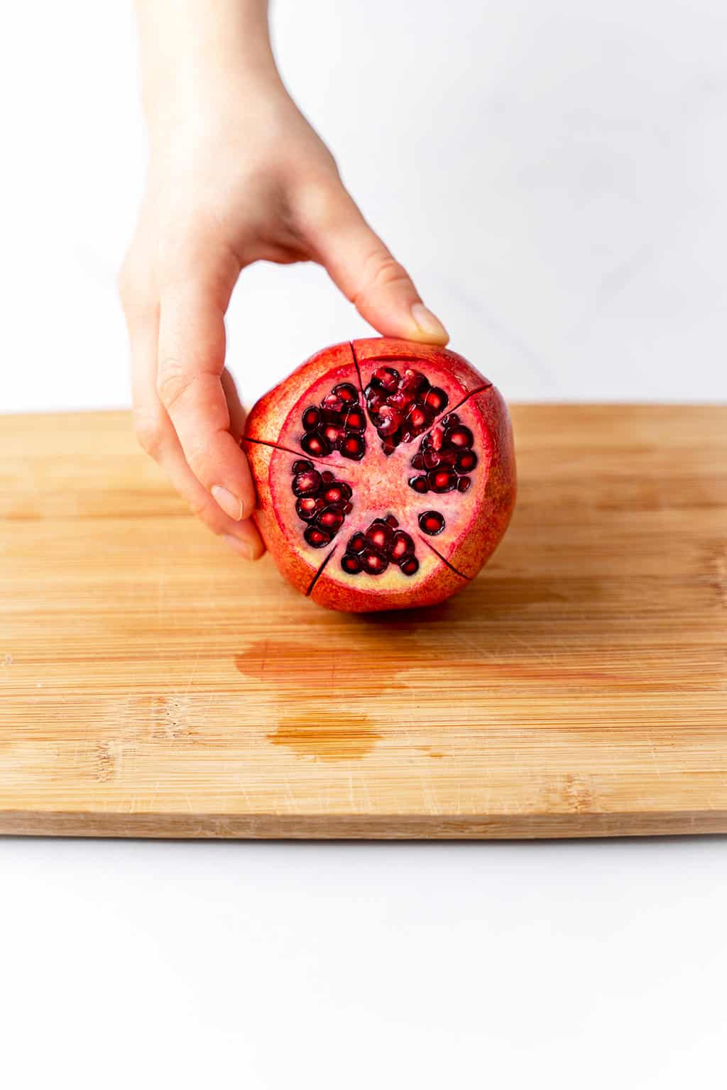 one pomegranate with five slices 