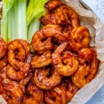 top view bbq shrimp with celery sticks on the side