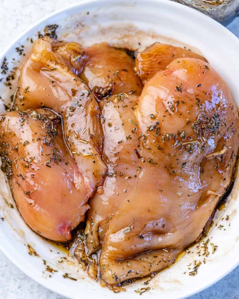 marinated chicken in a white bowl