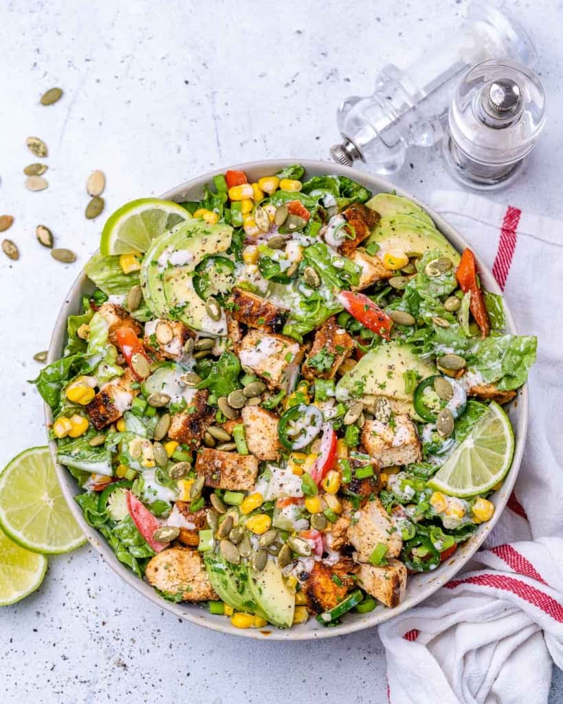 top view chicken chopped salad in a white bowl