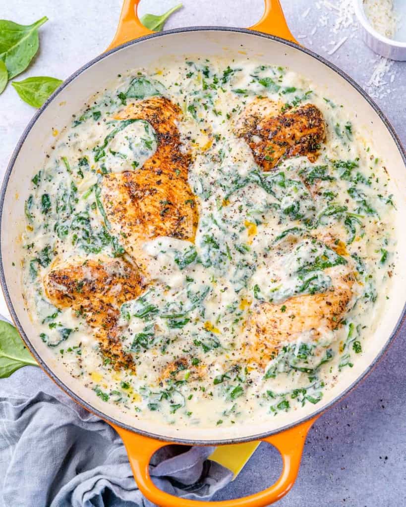 top view chicken breast cooked in a creamy spinach sauce 