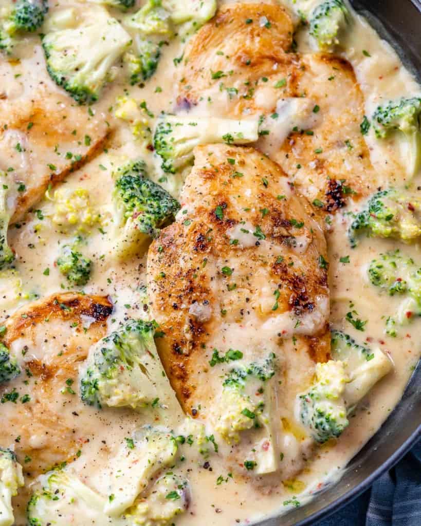 close up chicken in creamy mustard sauce and broccoli