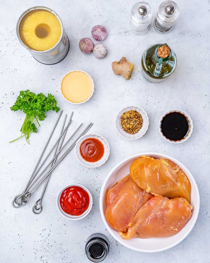 Parsley, chicken, Sriracha, ketchup, soy sauce, honey, vinegar, mustard, ginger, pineapple, and garlic for huli huli chicken