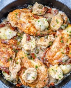 top view chicken breast in a creamy Mediterranean sauce