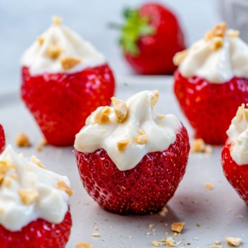 lined up strawberries stuffed with cream cheese stuffing