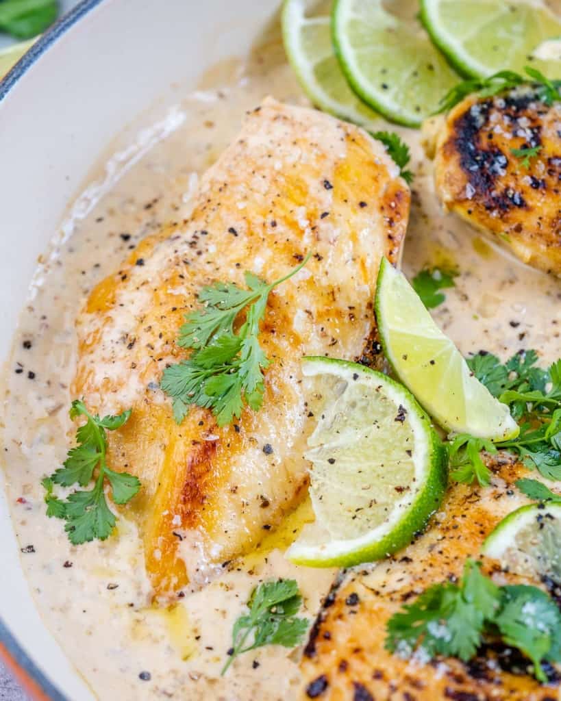 chicken breast in skillet with lime and cilantro