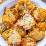 top view of roasted cauliflower in a white bowl