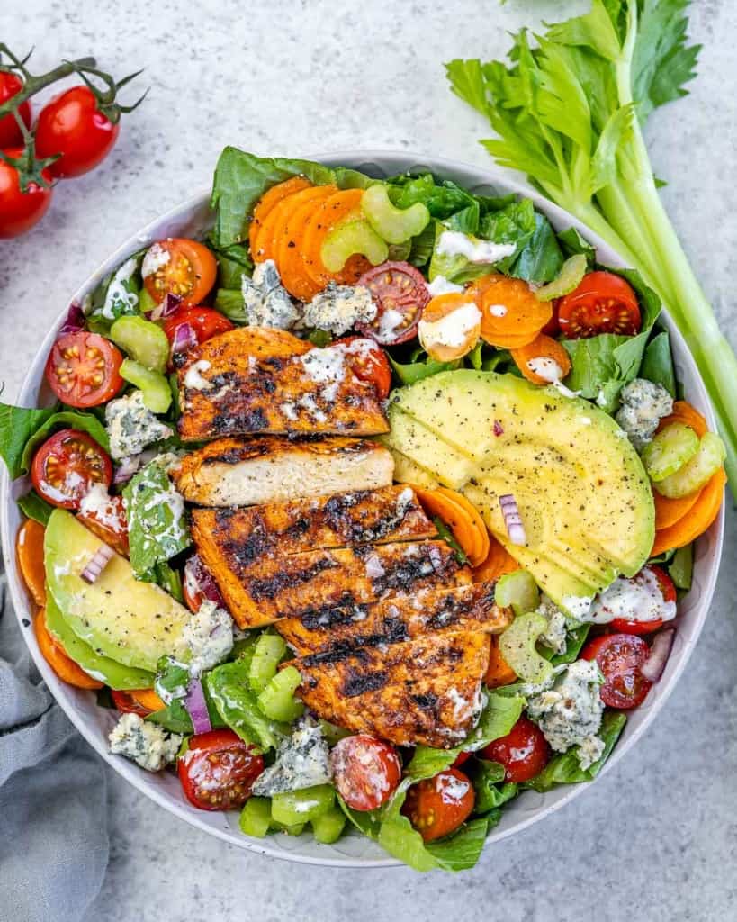 top view of salad with sliced grilled chicken breast