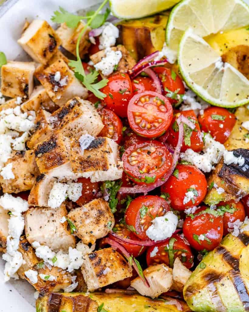 close image of tomatoes on chicken salad