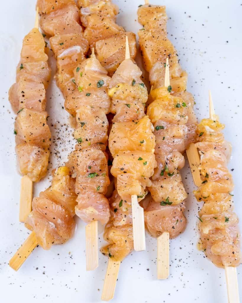 chicken on kabobs with herbs and seasoning