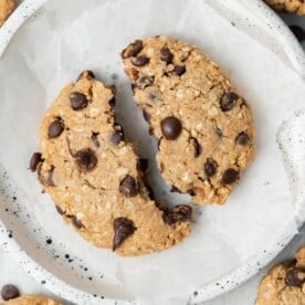 a cookie cut in a half on plate.