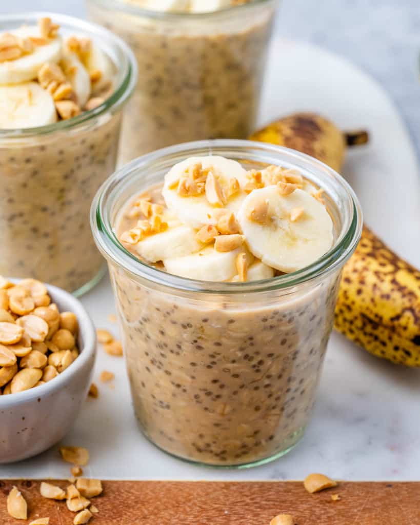 front view of overnight oats with sliced bananas and peanut butter