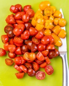 chopped tomatoes on a cutting board
