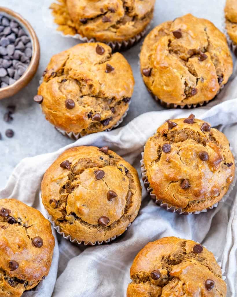 top view of chocolate chip banana muffins on a gray flat surface 