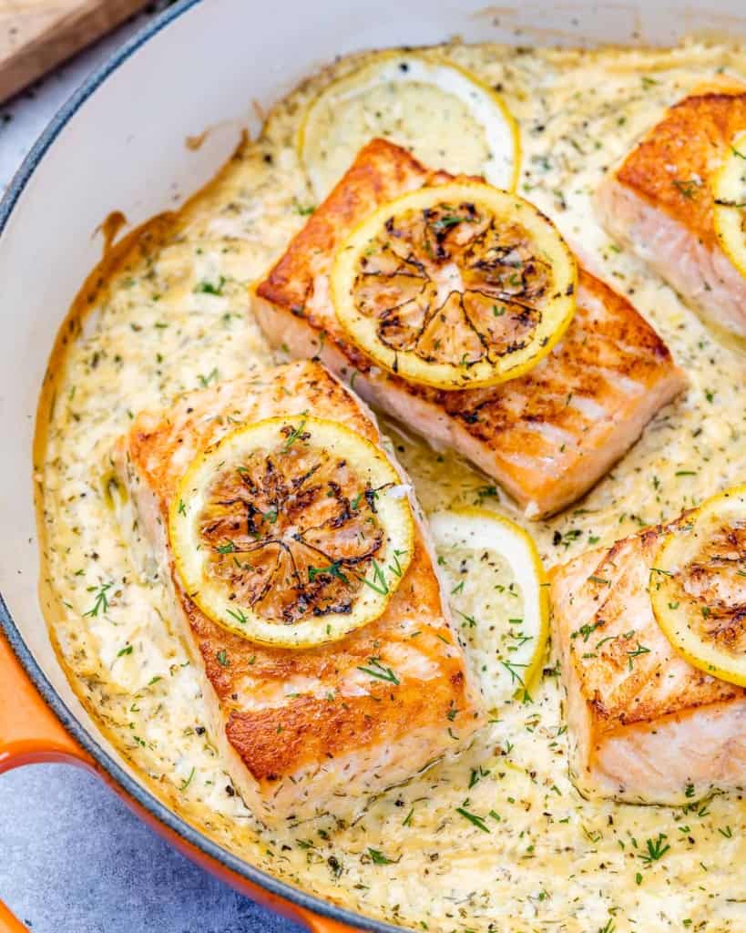 side shot of salmon in creamy sauce 
