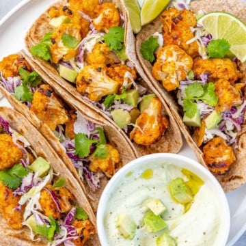 top view cauliflower tacos with sauce on the side