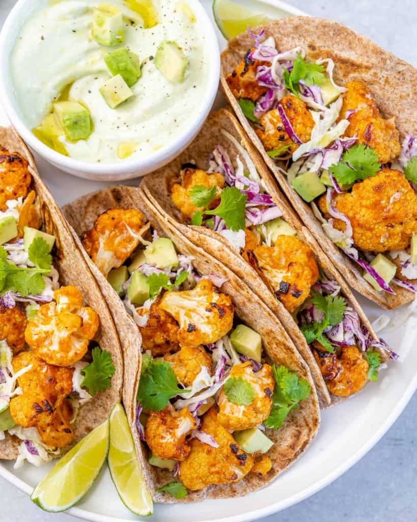 side shot of cauliflower taco on a white plate 