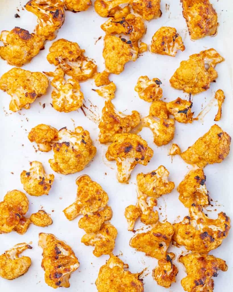 baked cauliflower florets in a baking sheet pan