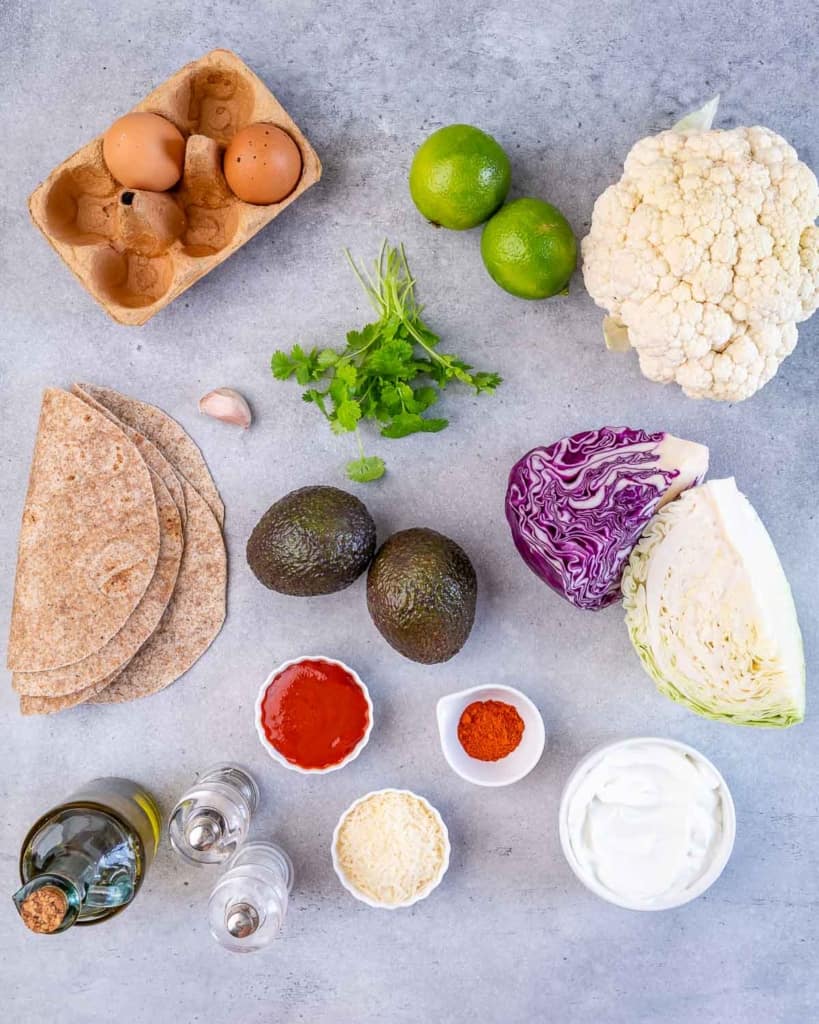 ingredients to make the vegetarian cauliflower taco laid out flat on a board