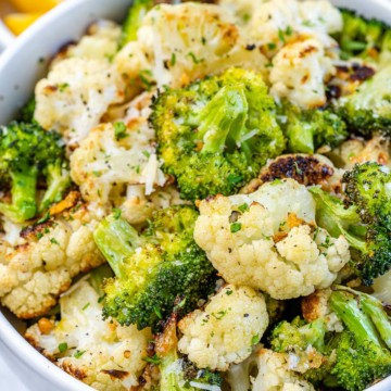 view of broccoli and cauliflower in white bowl with parsley