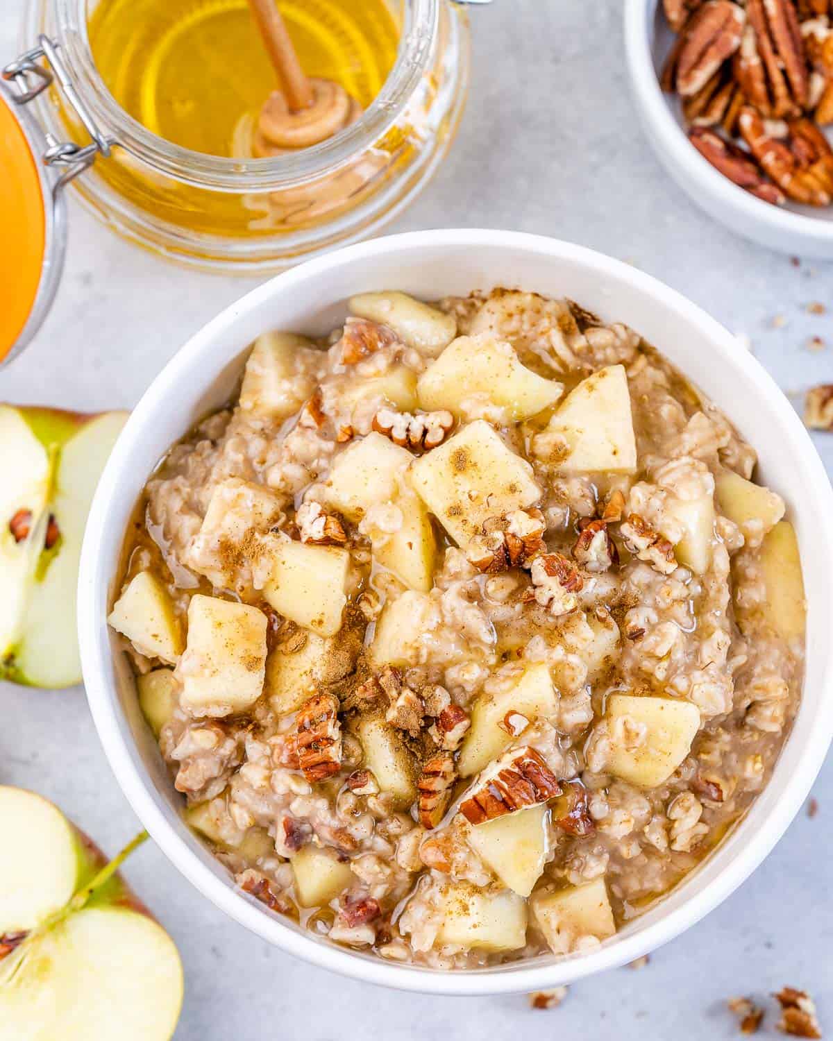 top view of apple cinnamon oatmeal with apples and pecans