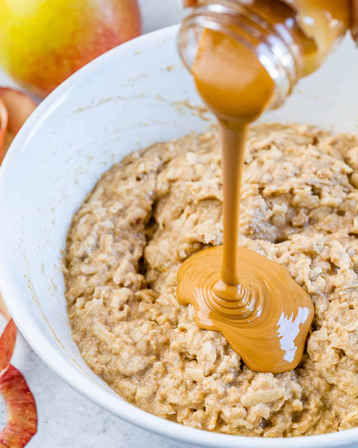 peanut butter being poured over batter