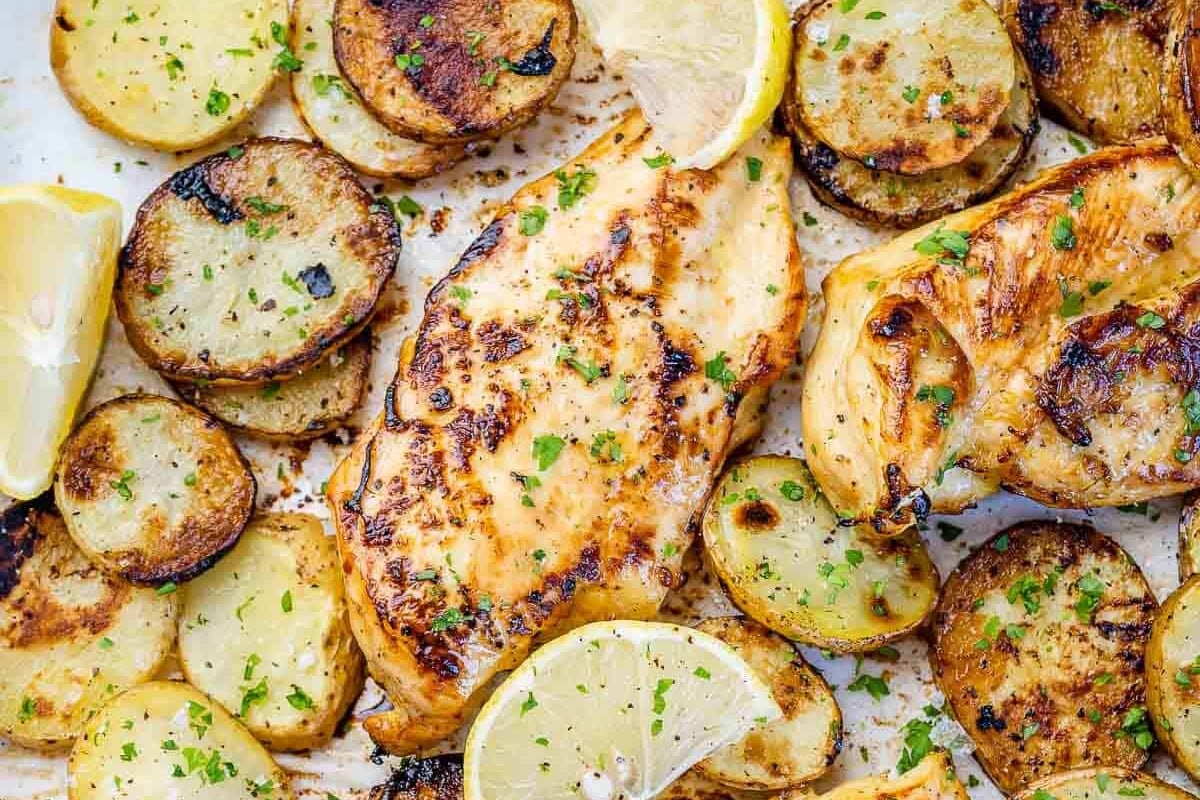 close up baked lemon chicken with potatoes