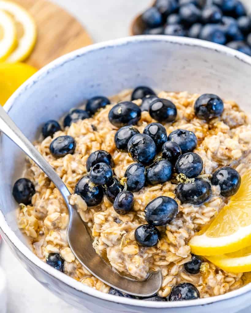 one bowl with blueberries and lemon wedges