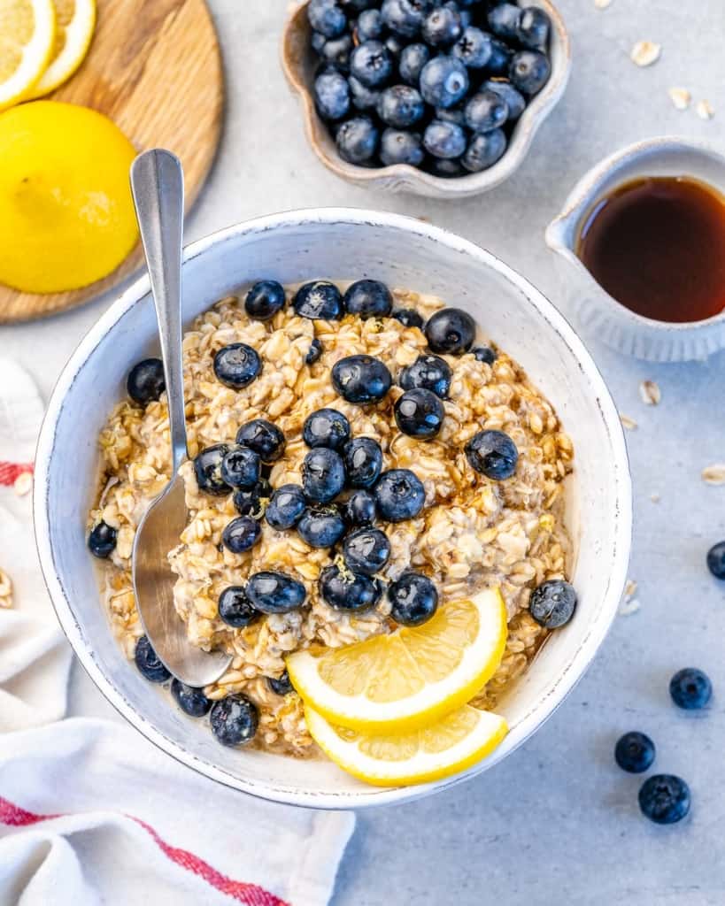 blueberry overnight oats in one bowl with lemon and blueberries