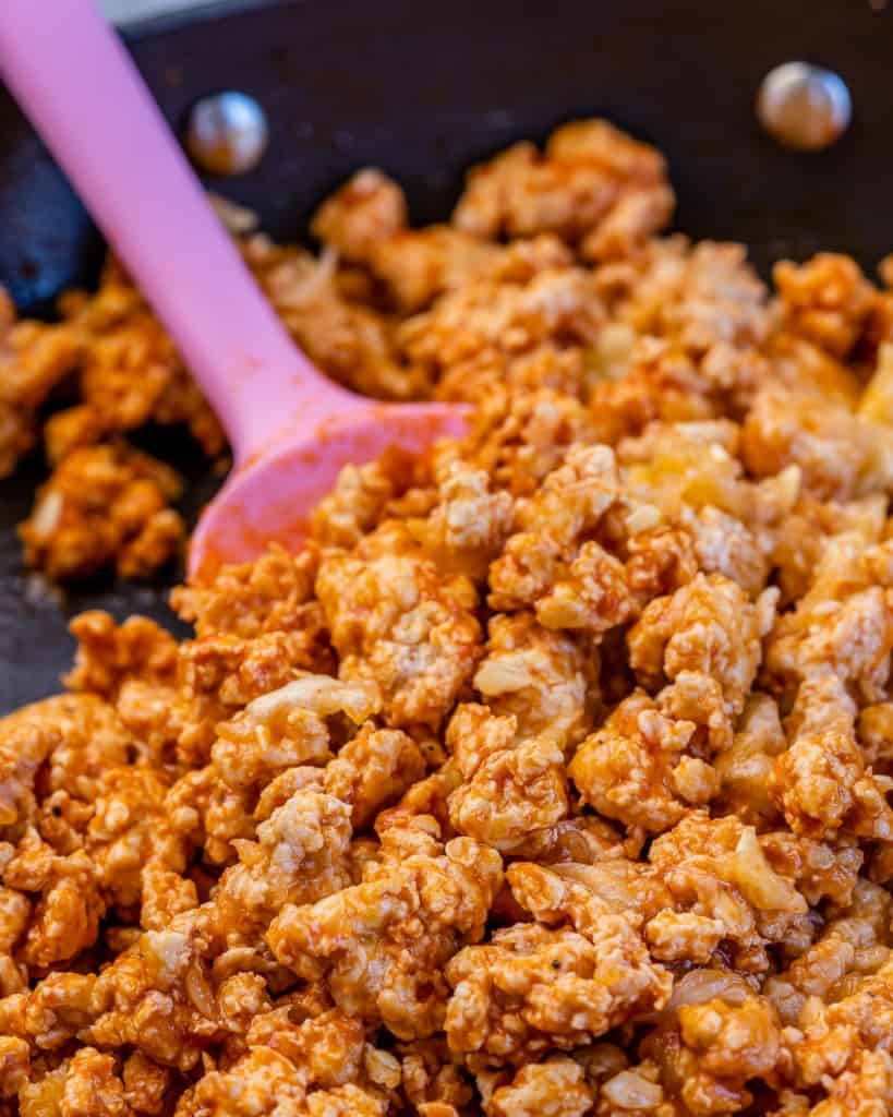 buffalo chicken stuffing being cooked on a pan