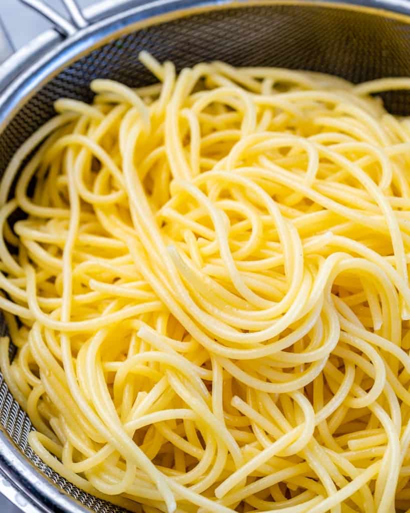 cooked spaghetti in a colander