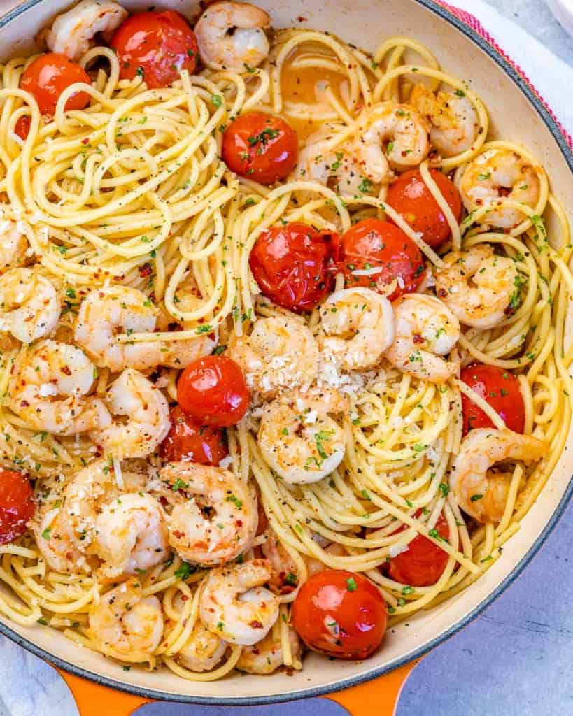 close up top view of shrimp pasta with cherry tomatoes 