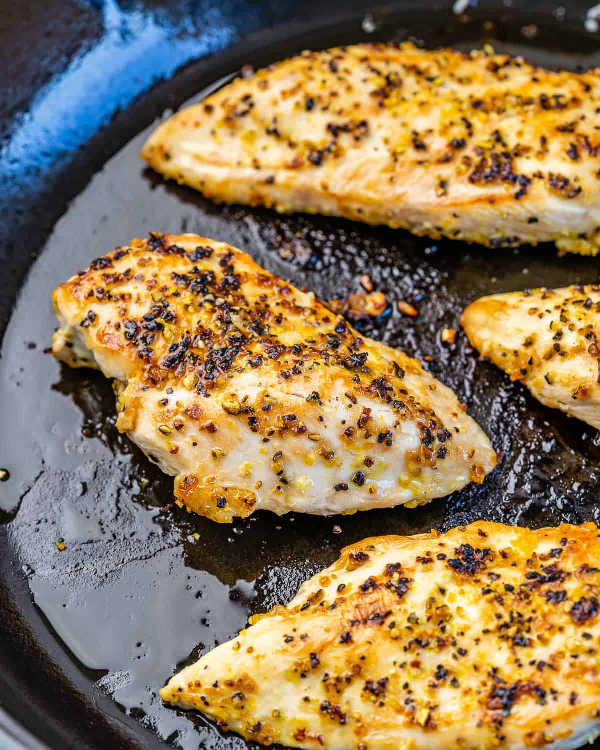 cooked chicken breast on a pan.