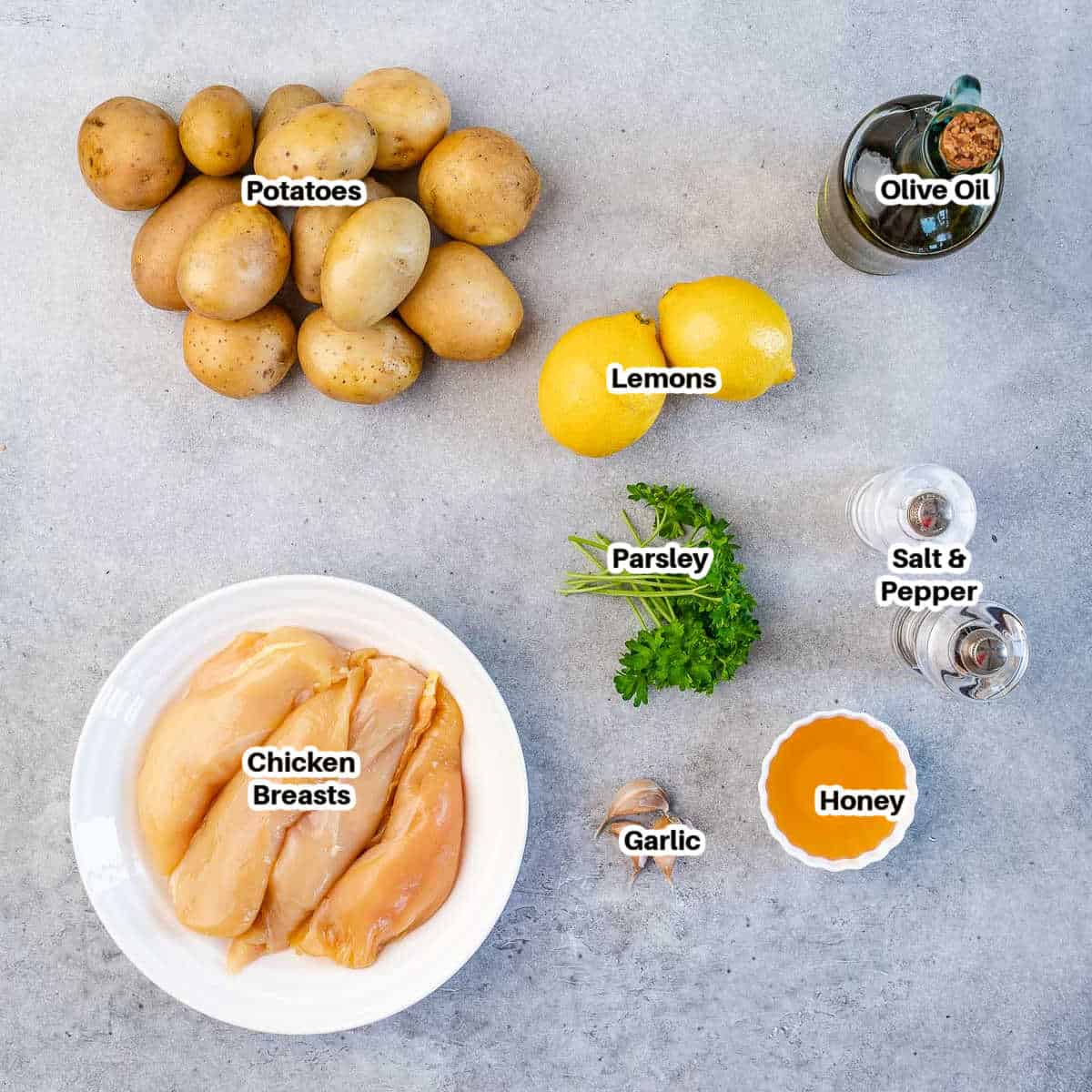 ingredients for lemon chicken and potatoes cooked on a sheet pan.