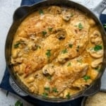 top view of chicken breast in creamy sauce in a black skillet