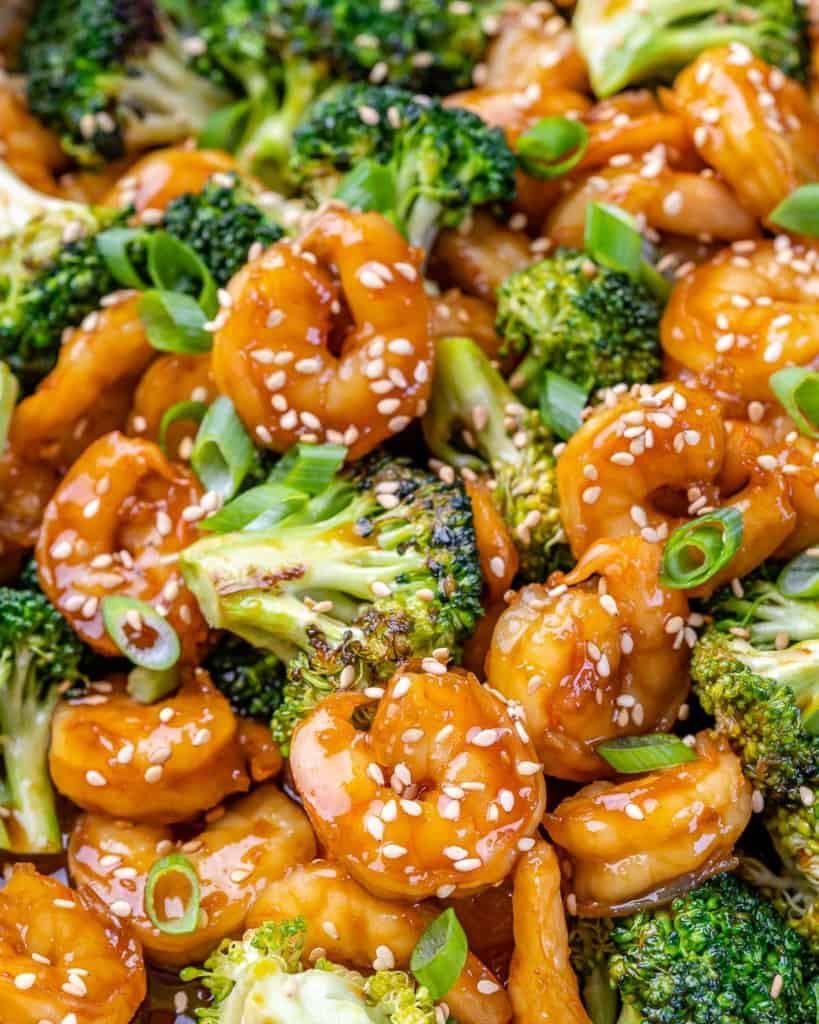 top view of shrimp and broccoli with sauce